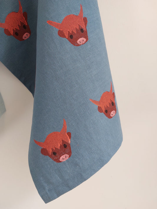 highland coo tea towel mid blue