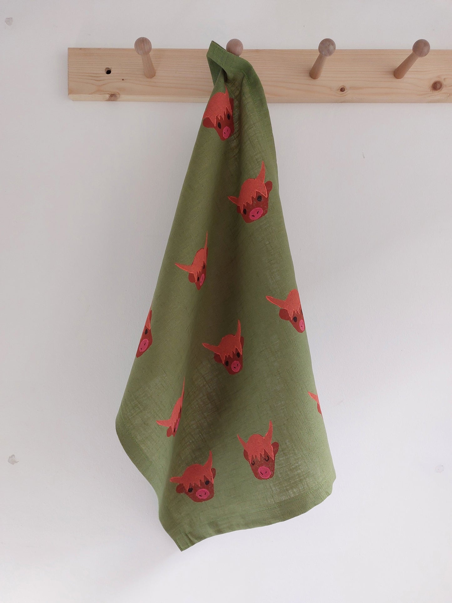 highland coo tea towel avocado