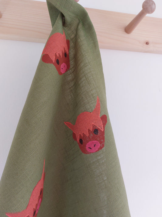 highland coo tea towel avocado