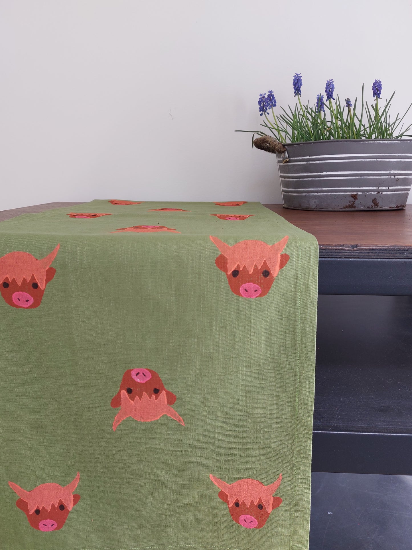 table runner highland coo on avocado linen