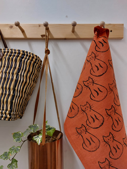 black cat tea towel terracotta