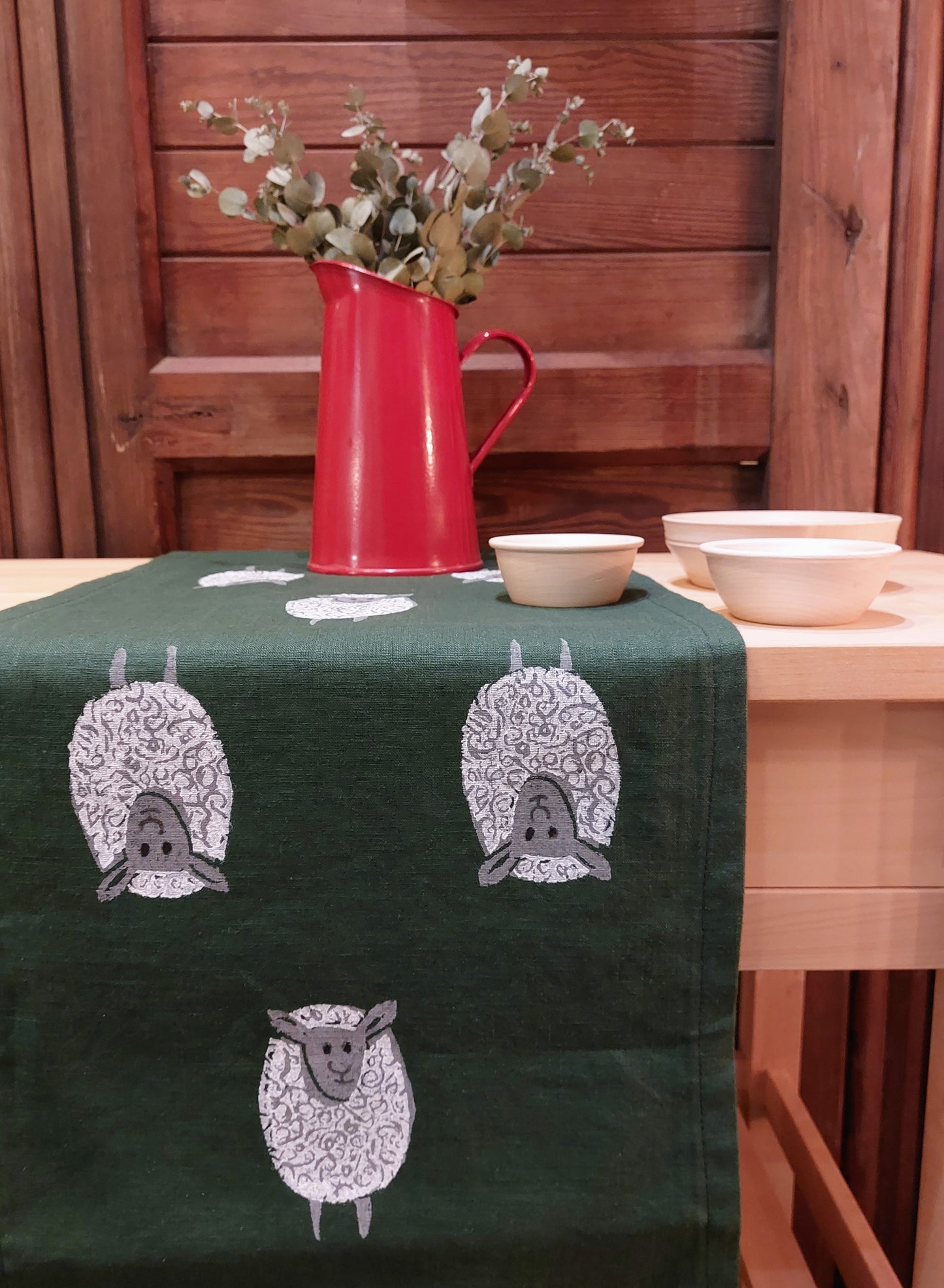 table runner sheep on forest green linen