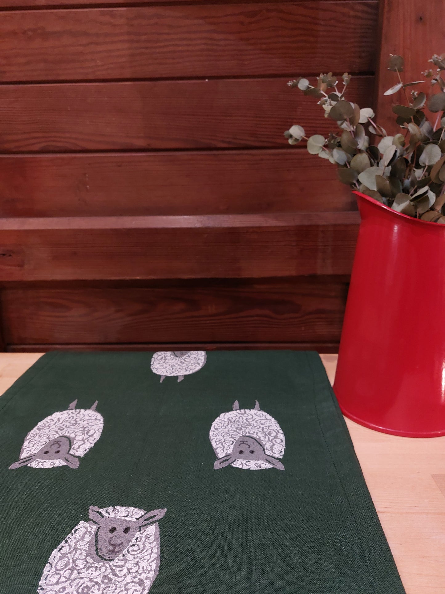 table runner sheep on forest green linen