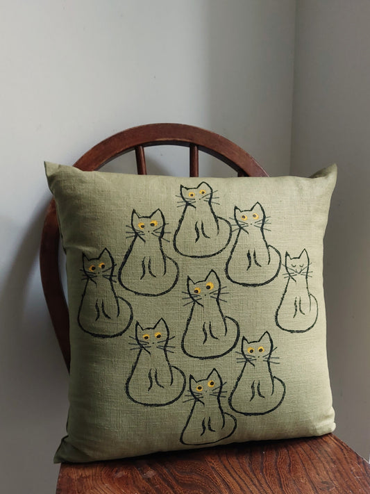 cats on pistachio cushion