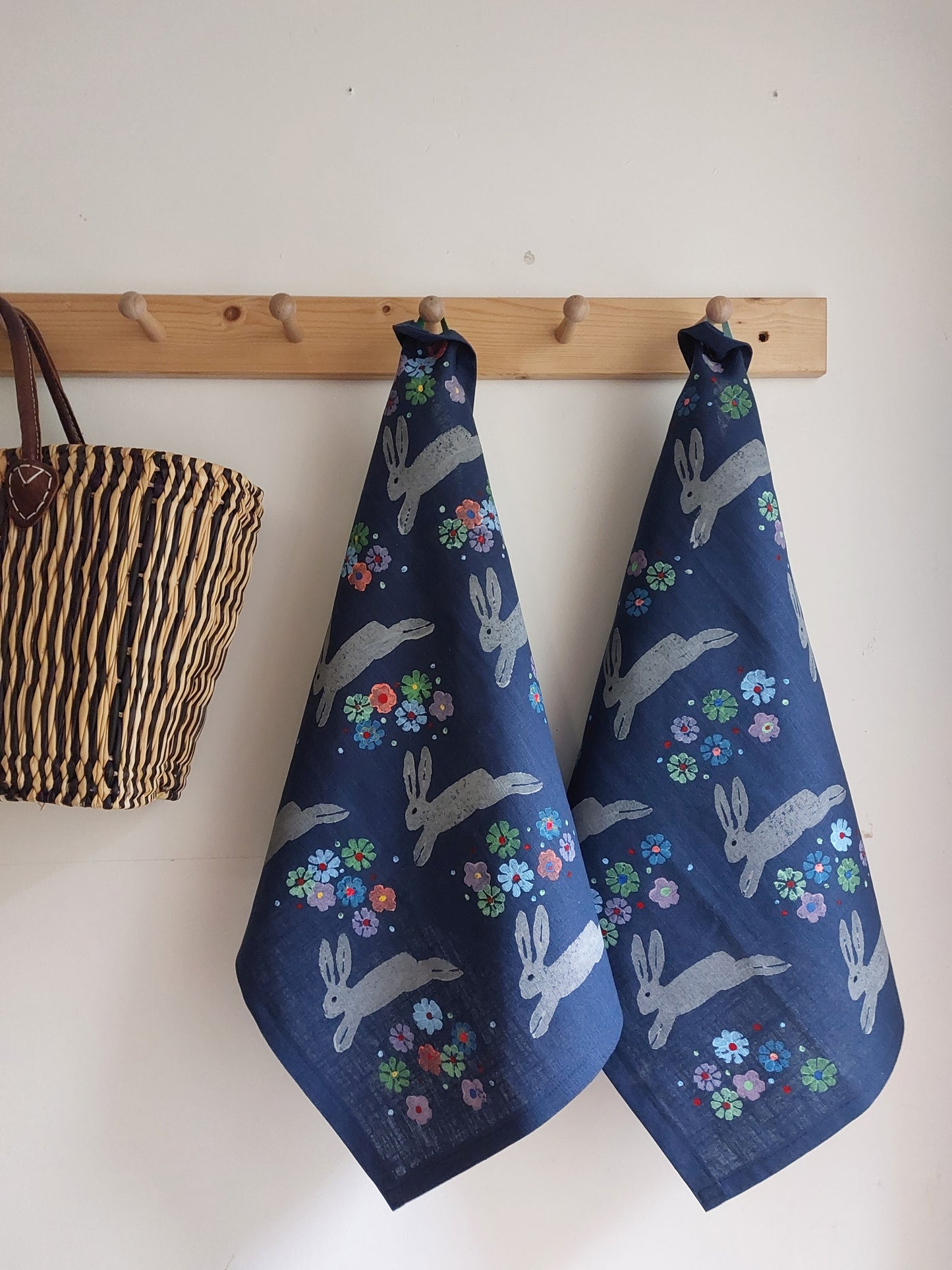 leaping spring hare tea towel navy