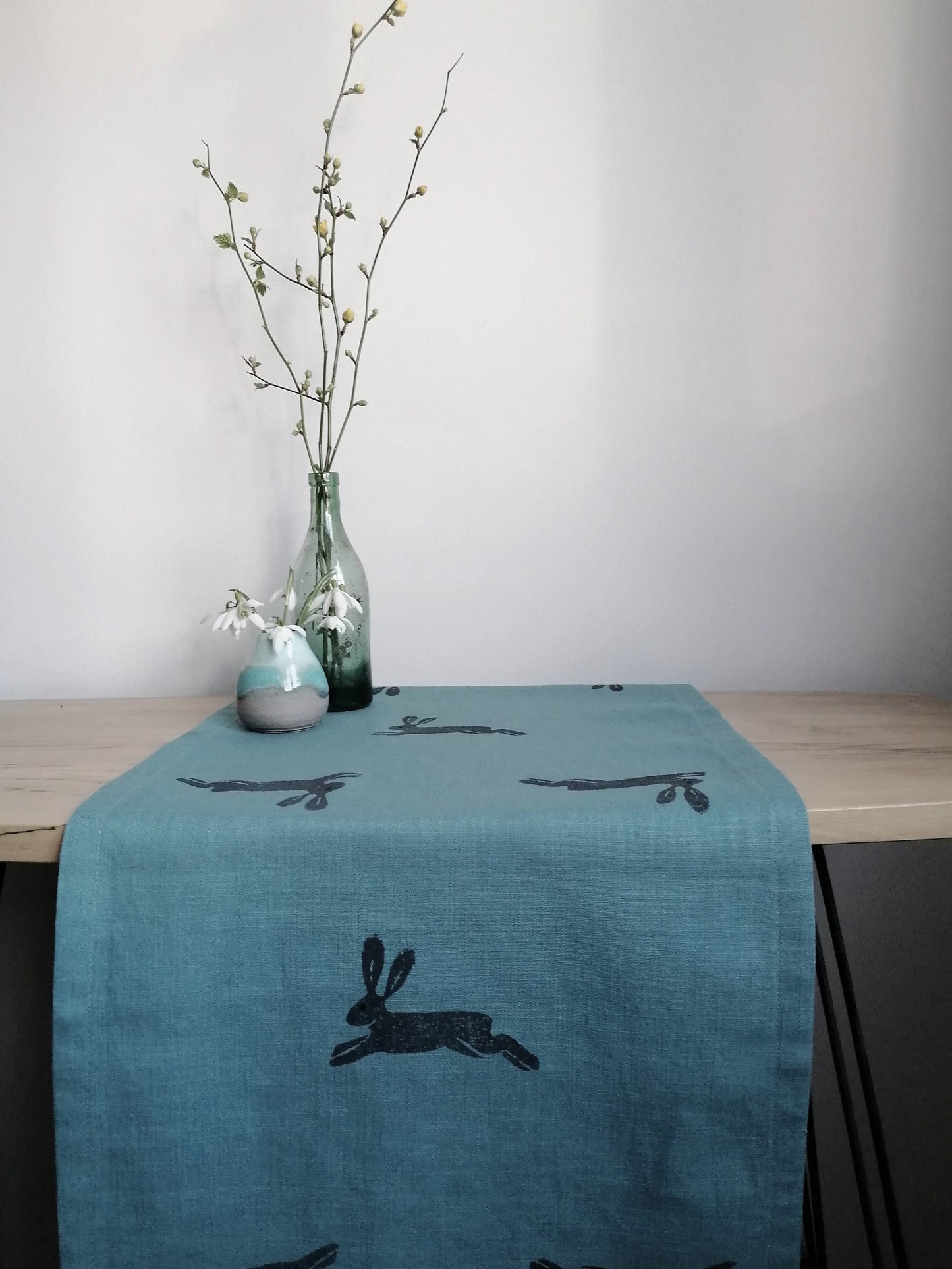 table runner hares on light teal linen